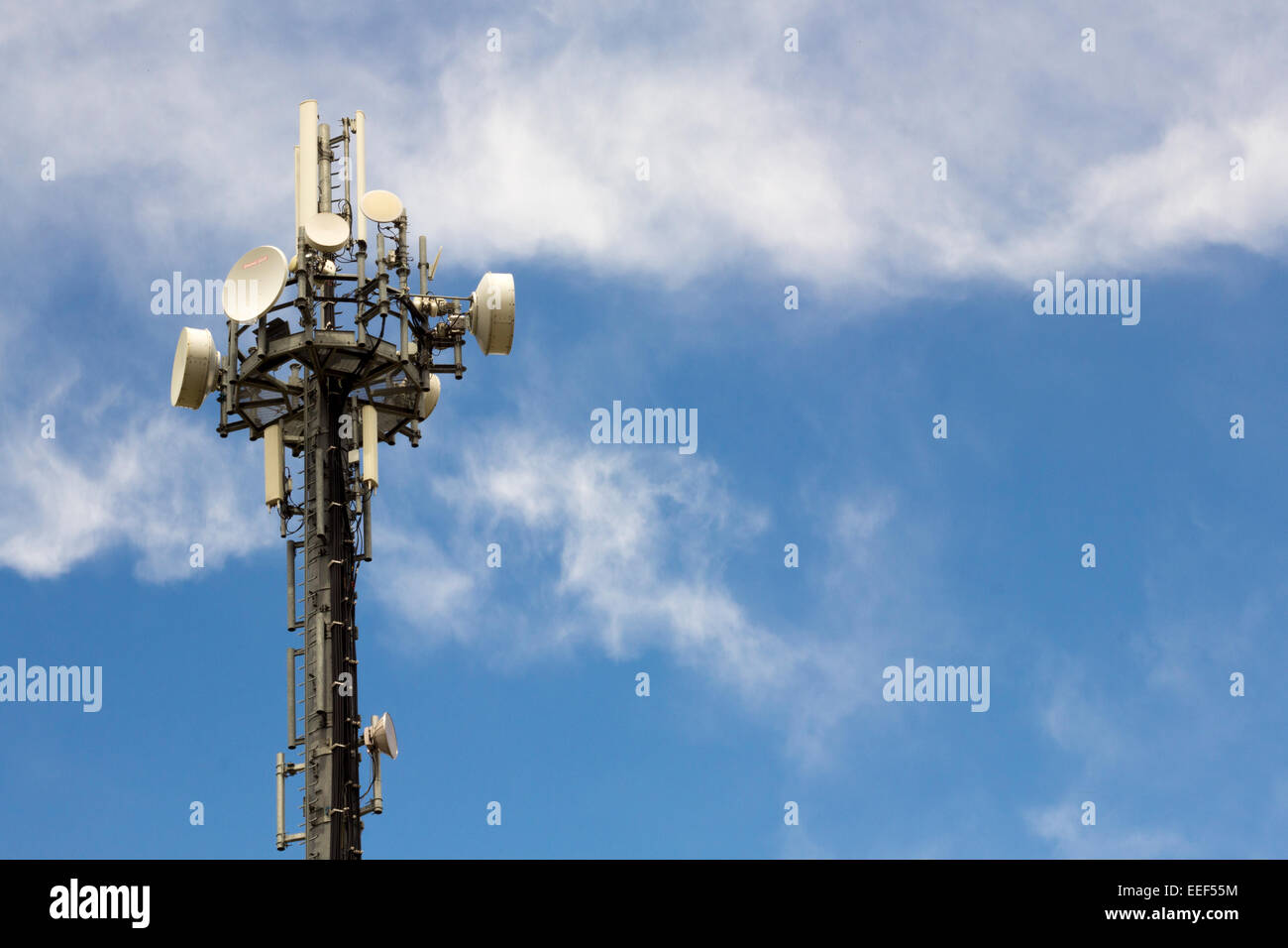 Satellite dish and Communications Tower for microwave signal Stock