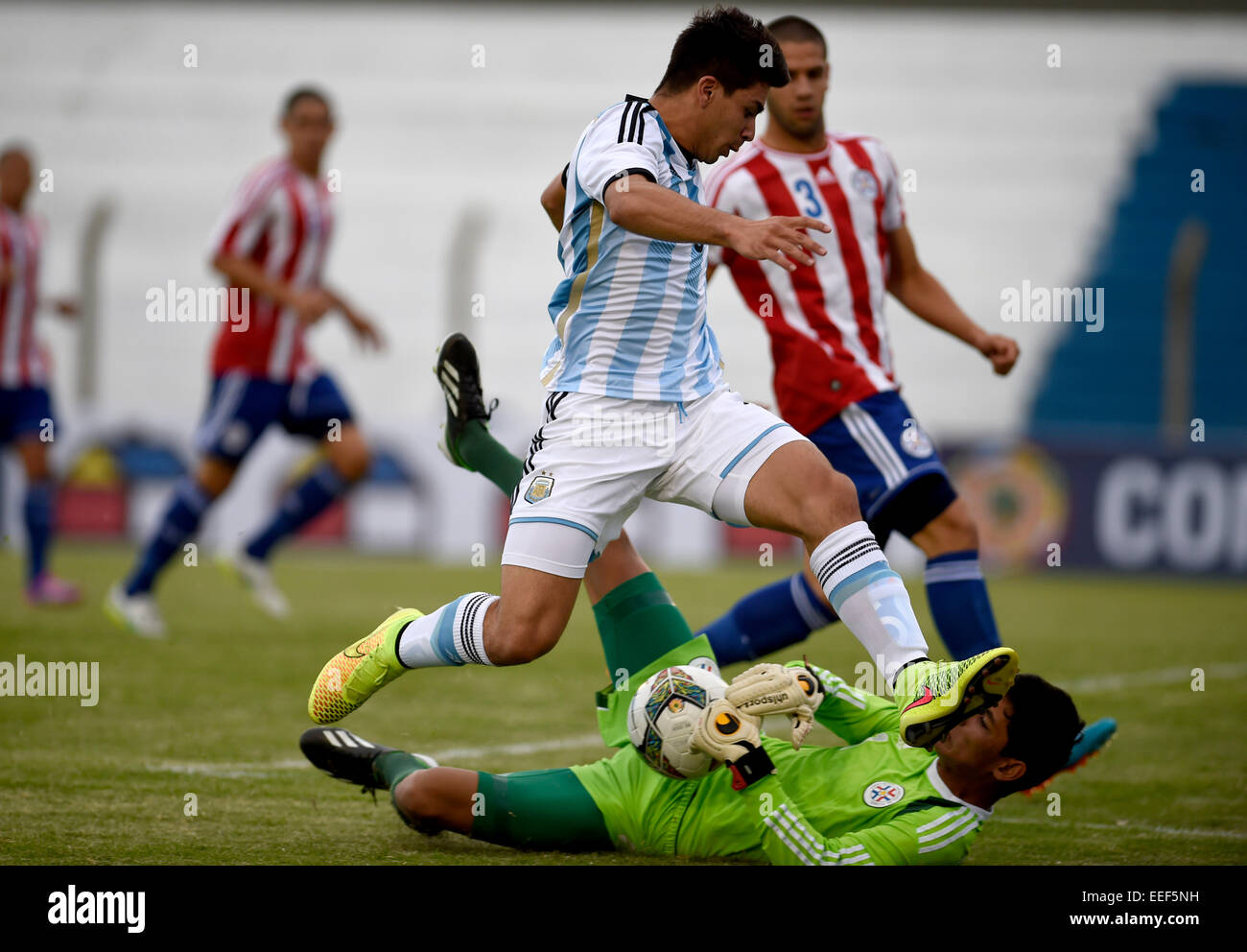 Colonia, Uruguay. 16th Jan, 2015. Player Giovanni Simeone (Top) of Argentina, vies the ball with goalkeeper Tomas Echague of Paraguay during the match of the South american U20 tournament, held in the Alberto Supici Stadium, in Colonia, 200km away of Montevideo, capital of Uruguay, on Jan. 16, 2015. Credit:  Nicolas Celaya/Xinhua/Alamy Live News Stock Photo