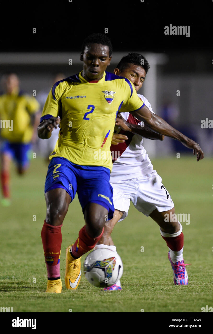 Colonia, Uruguay. 16th Jan, 2015. Player Gabriel Corozo (front) of Ecuador vies the ball with Miguel Carranza of Peru during the match of the South american U20 tournament, held in the Alberto Supici Stadium, in Colonia, 200km away of Montevideo, capital of Uruguay, on Jan. 16, 2015. Credit:  Nicolas Celaya/Xinhua/Alamy Live News Stock Photo