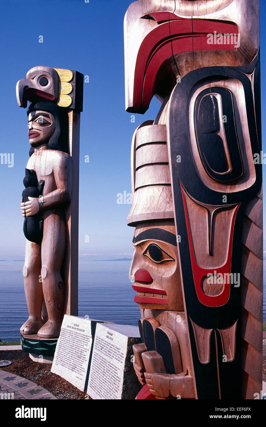 Coast Salish and Haida Totem Poles along Semiahmoo Bay, White Rock, BC, British Columbia, Canada Stock Photo