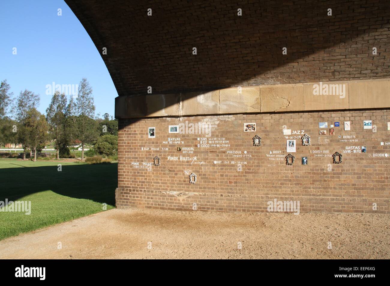 A memorial wall to pet dogs that have died under a viaduct in at