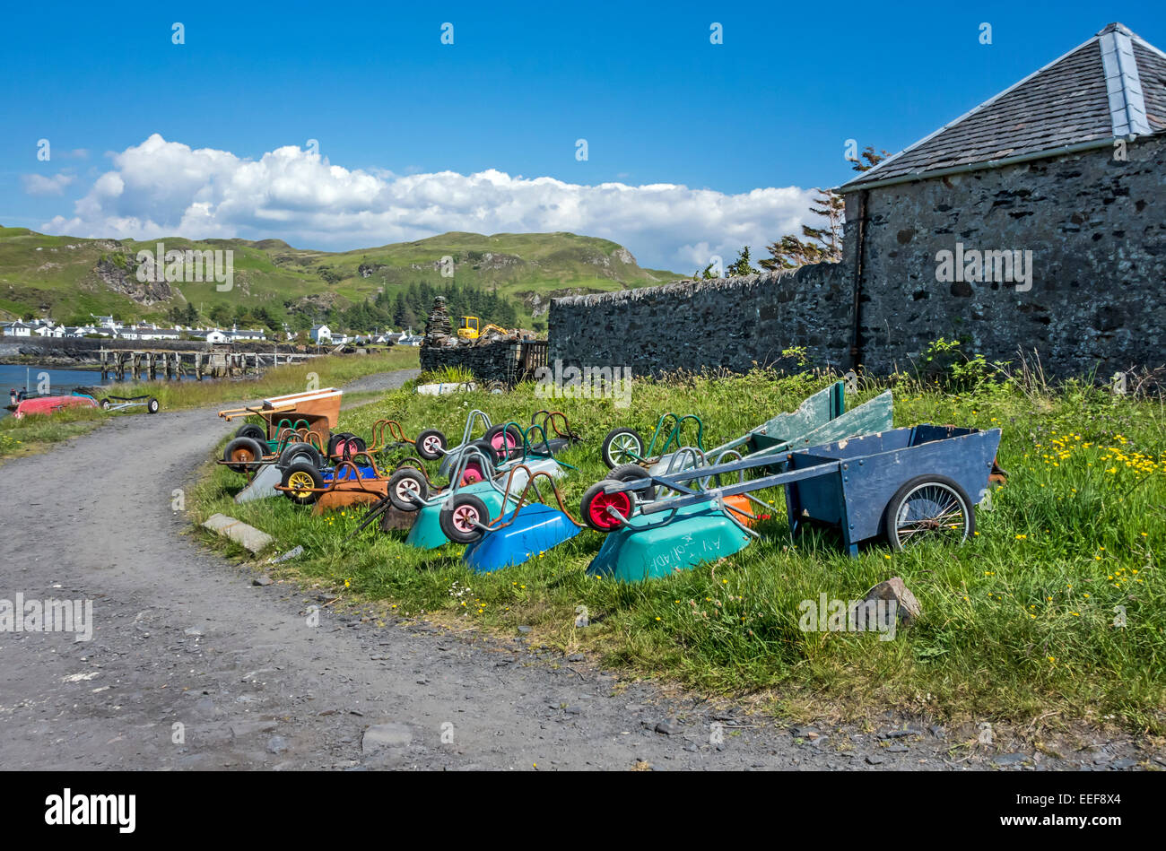 Wheel Barrows at ferry terminal on island of Easdale by Seil in Argyll Scotland Stock Photo