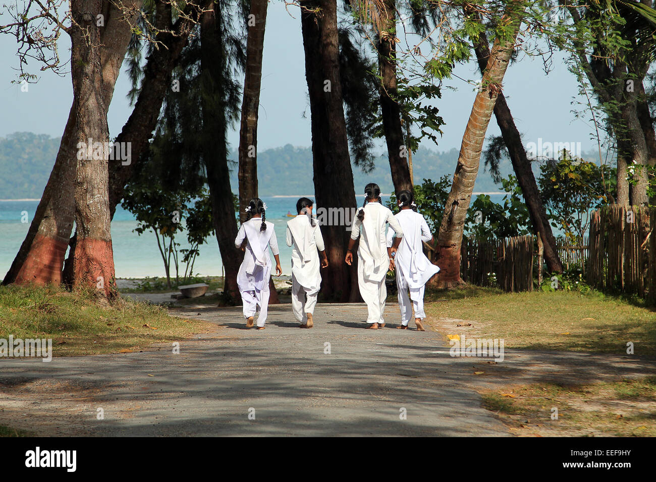 Indian schoolgirls walking to a beach Stock Photo