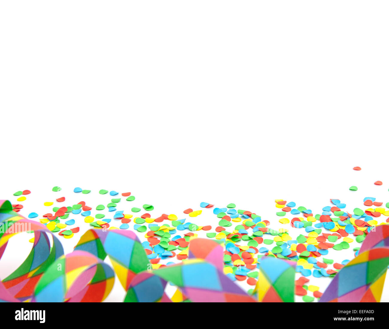 Party streamer and confetti on white background Stock Photo - Alamy