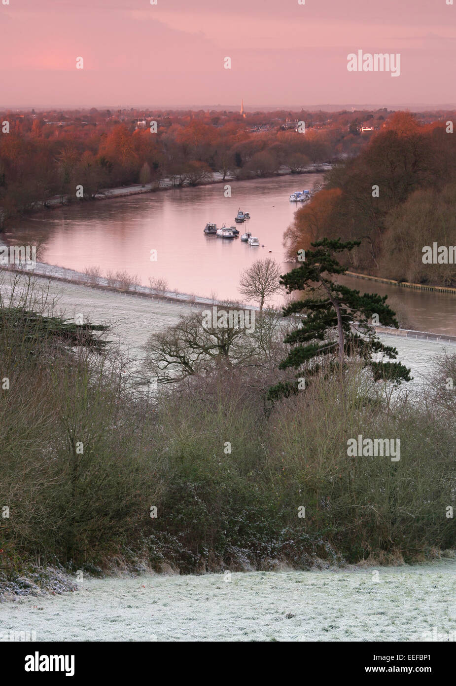View over the River Thames, from Richmond Hill, Surrey, UK. on a frosty winters morning. Red sky in morning Shepard's warning. Stock Photo