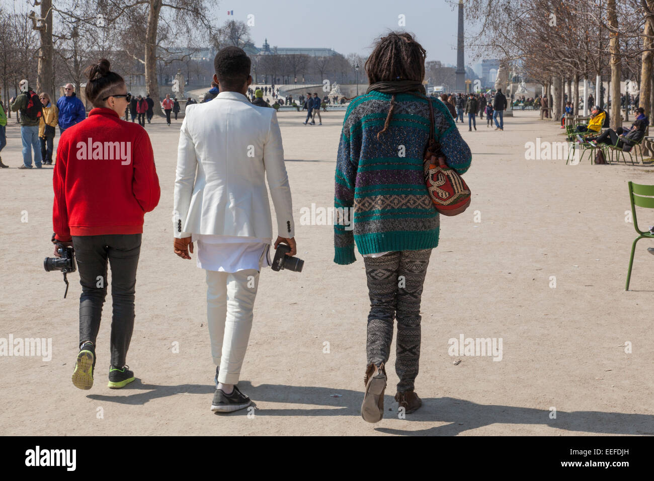 people walking along the Tuileries in Paris, France Stock Photo