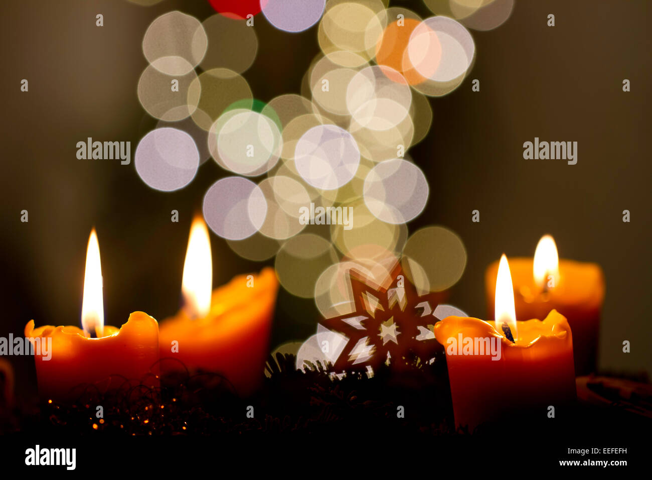 Advent wreath with four lit candles Stock Photo