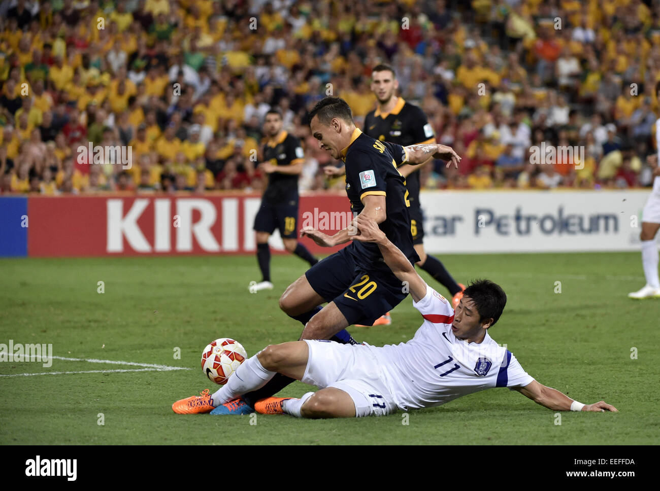 Brisbane. 17th Jan, 2015. Lee Keun Ho (in white) of South Korea vies with Trent Sainsbury of Australia during a Group A match between Australia and South Korea of the AFC Asian Cup in Brisbane, Australia, Jan.17, 2015. South Korea won 1-0. Credit:  Qin Qing/Xinhua/Alamy Live News Stock Photo
