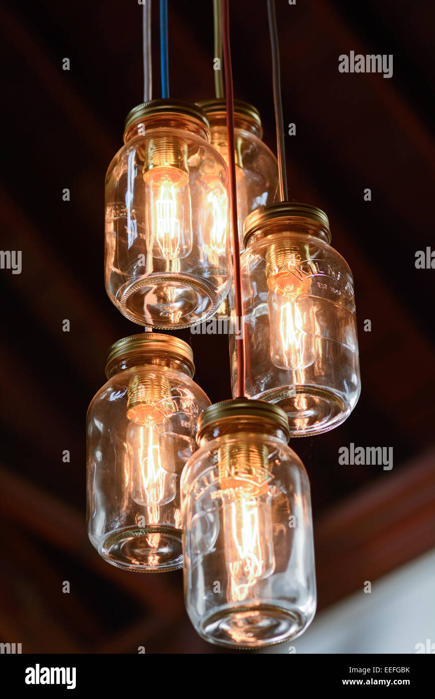 Ornate lightbulbs designed inside glass jars Stock Photo Alamy