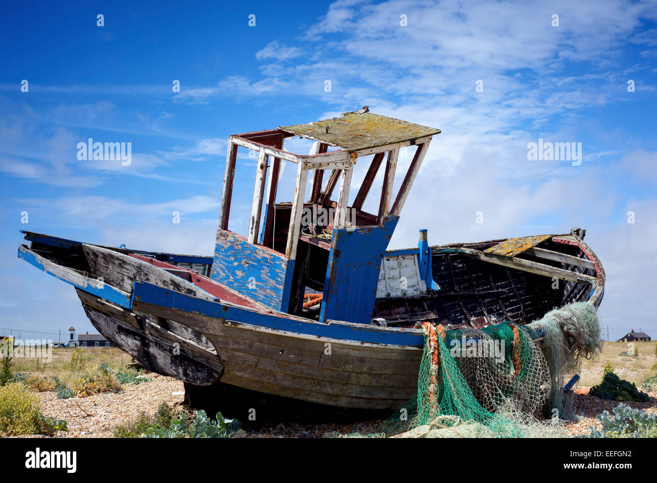 An old abandoned fishing boat stranded on a beech Stock Photo - Alamy