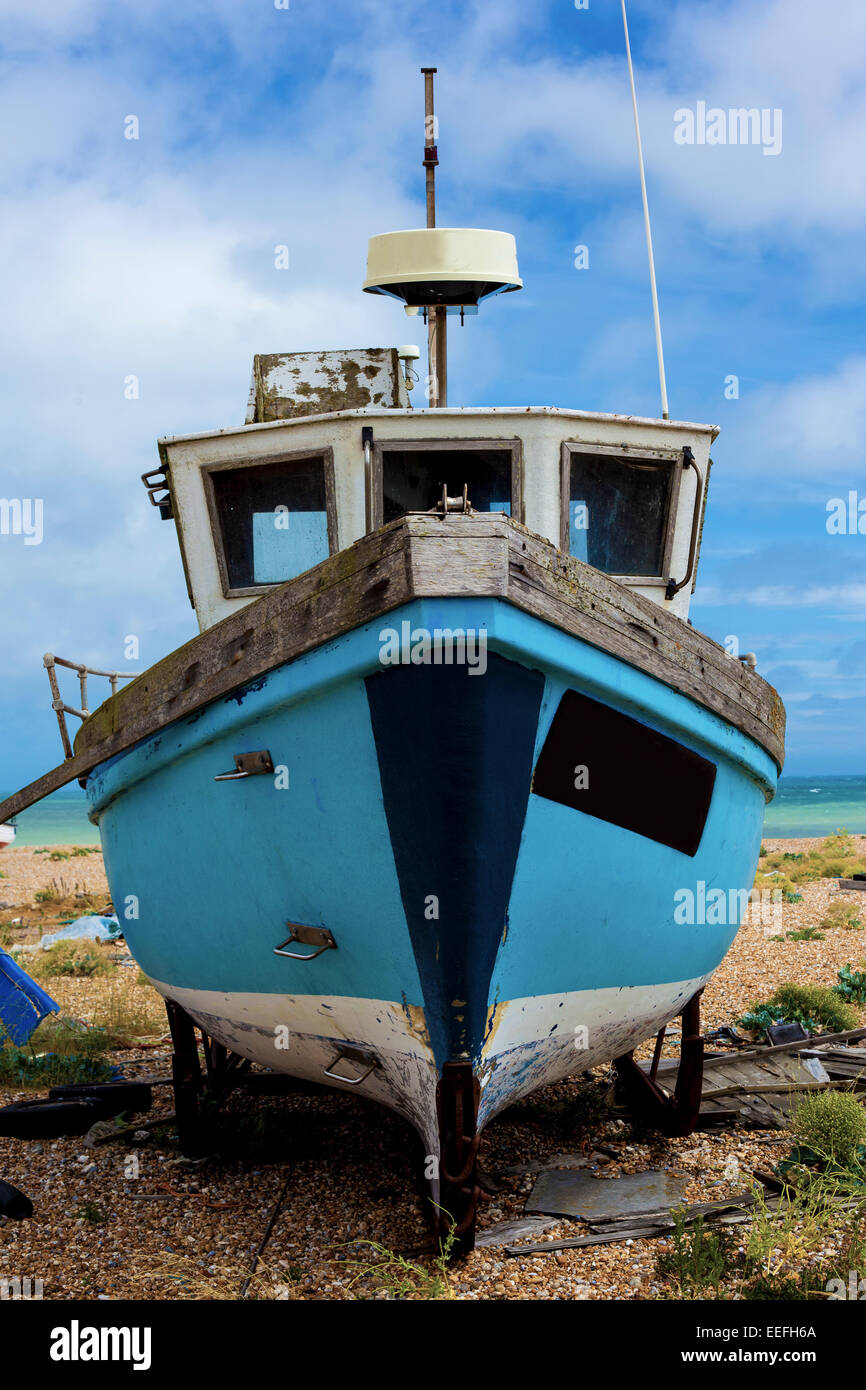 An old abandoned fishing boat stranded on a beech Stock Photo - Alamy