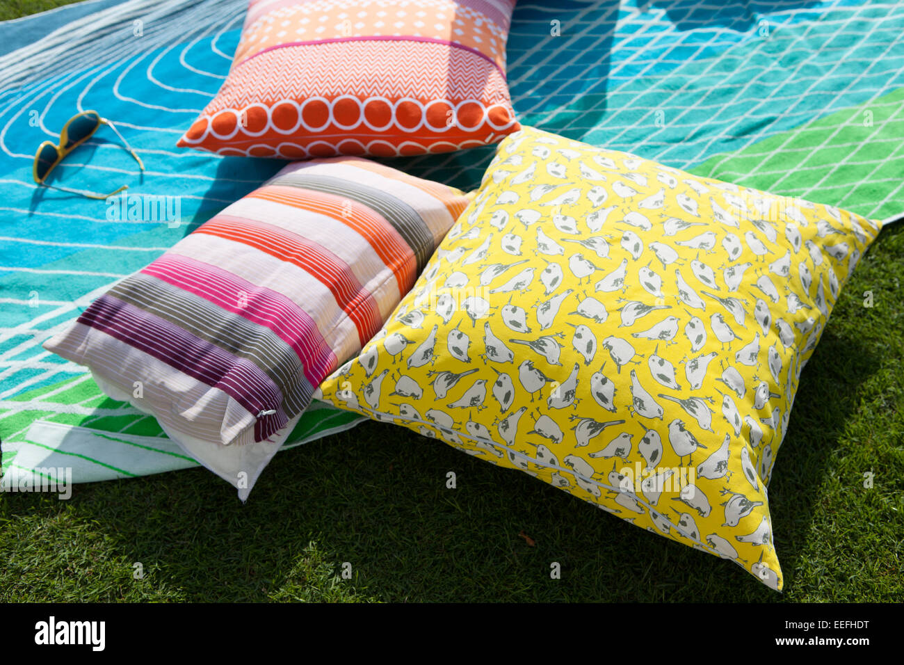 Colourful cushions and rug by Habitat Stock Photo Alamy