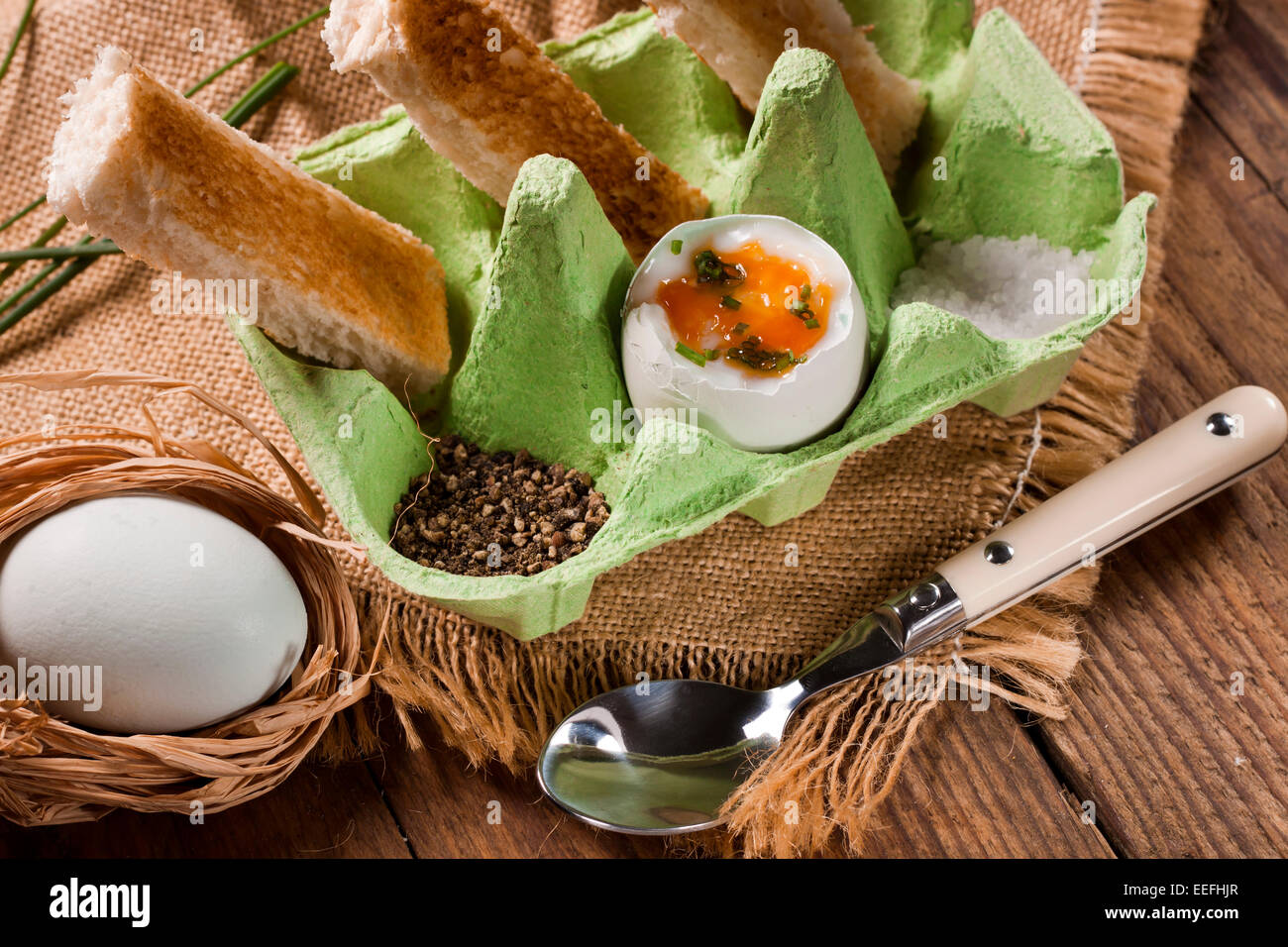 Free range eggs and toasted bread soldiers served in a green egg