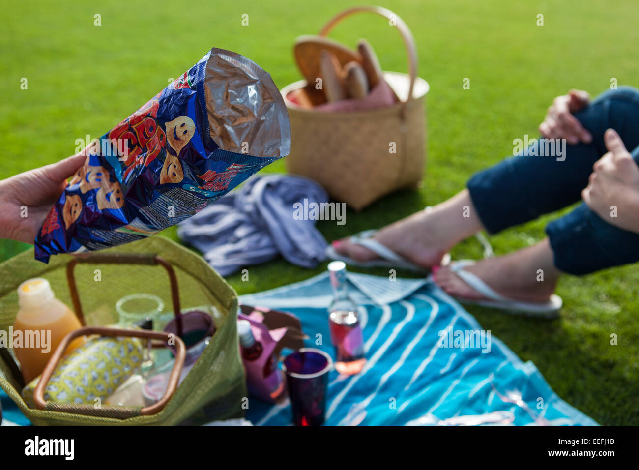 Picnic, lunch 'al fresco' with colourful rug Stock Photo