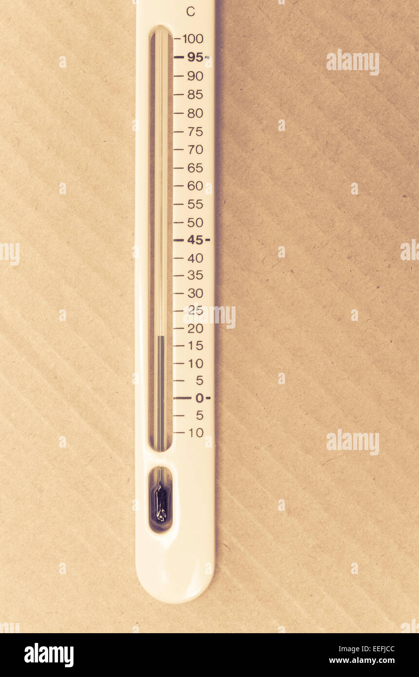 glass bulb thermometer on a paperboard surface Stock Photo Alamy