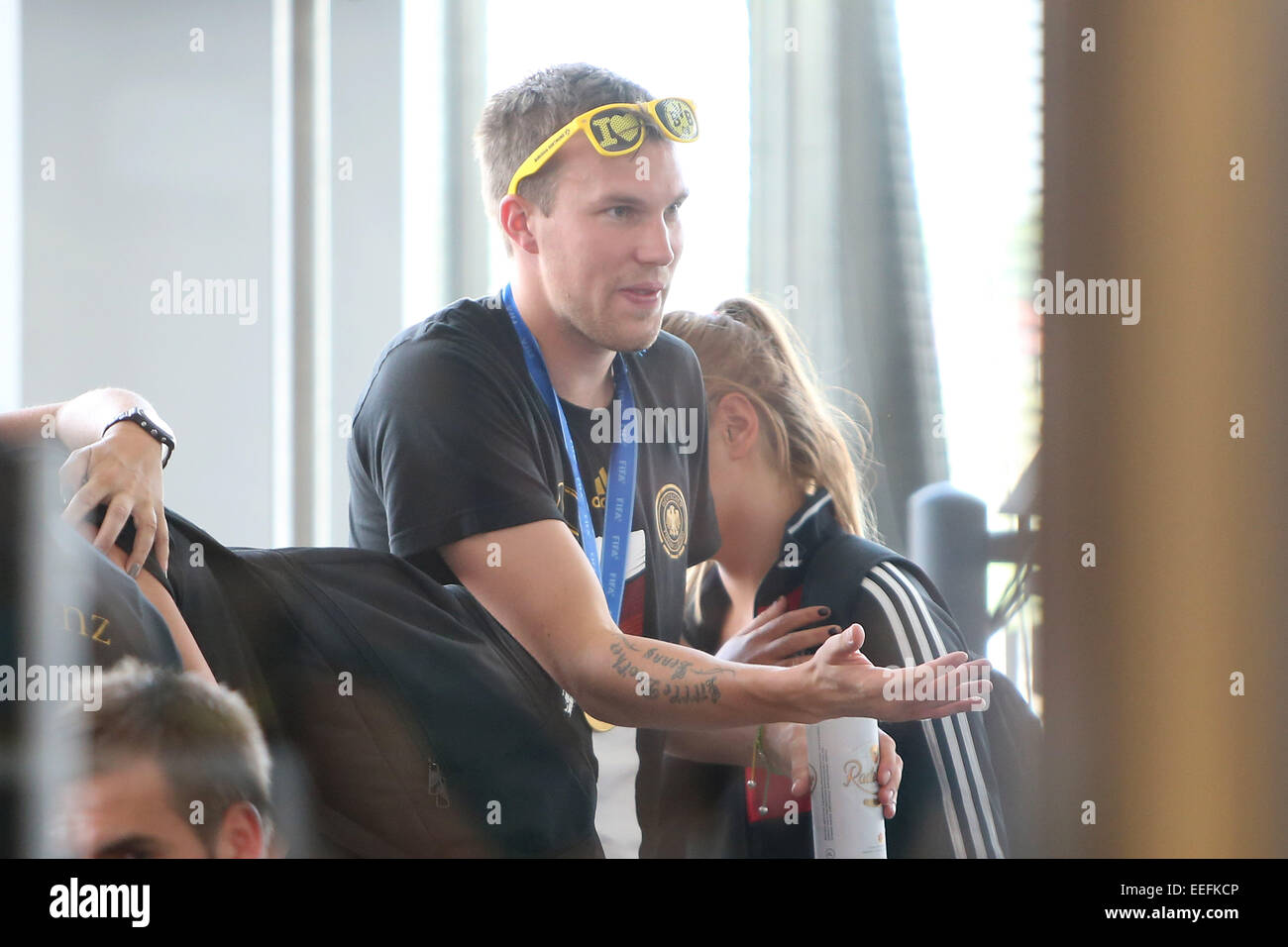 Members of the German National Football Team checking in at Tegel airport to fly to their home towns.  Featuring: Kevin Grosskreutz Where: Berlin, Germany When: 15 Jul 2014 Stock Photo
