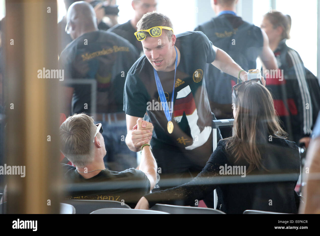 Members of the German National Football Team checking in at Tegel airport to fly to their home towns.  Featuring: Kevin Grosskreutz Where: Berlin, Germany When: 15 Jul 2014 Stock Photo