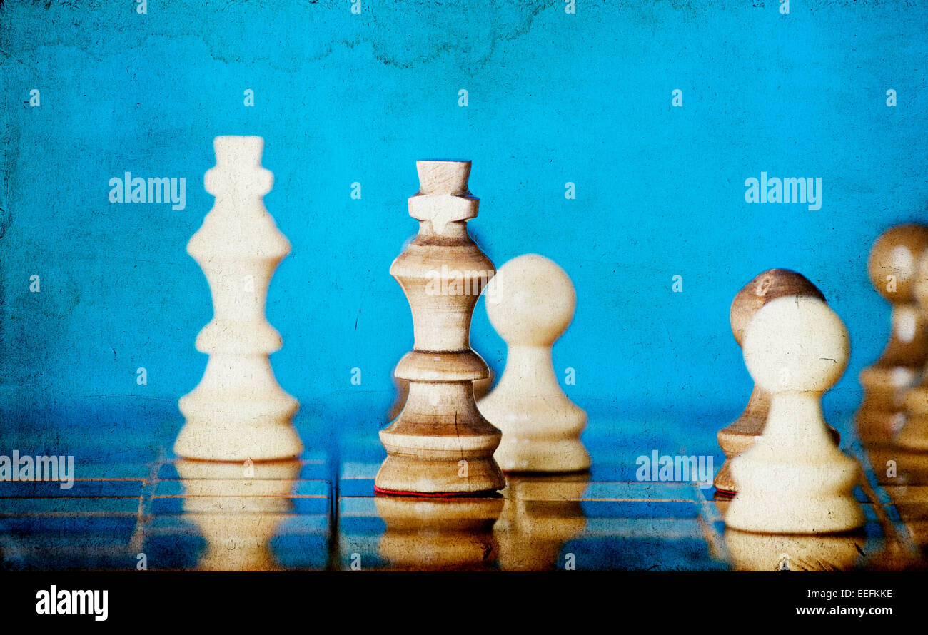 Chess pieces on blue background Stock Photo - Alamy