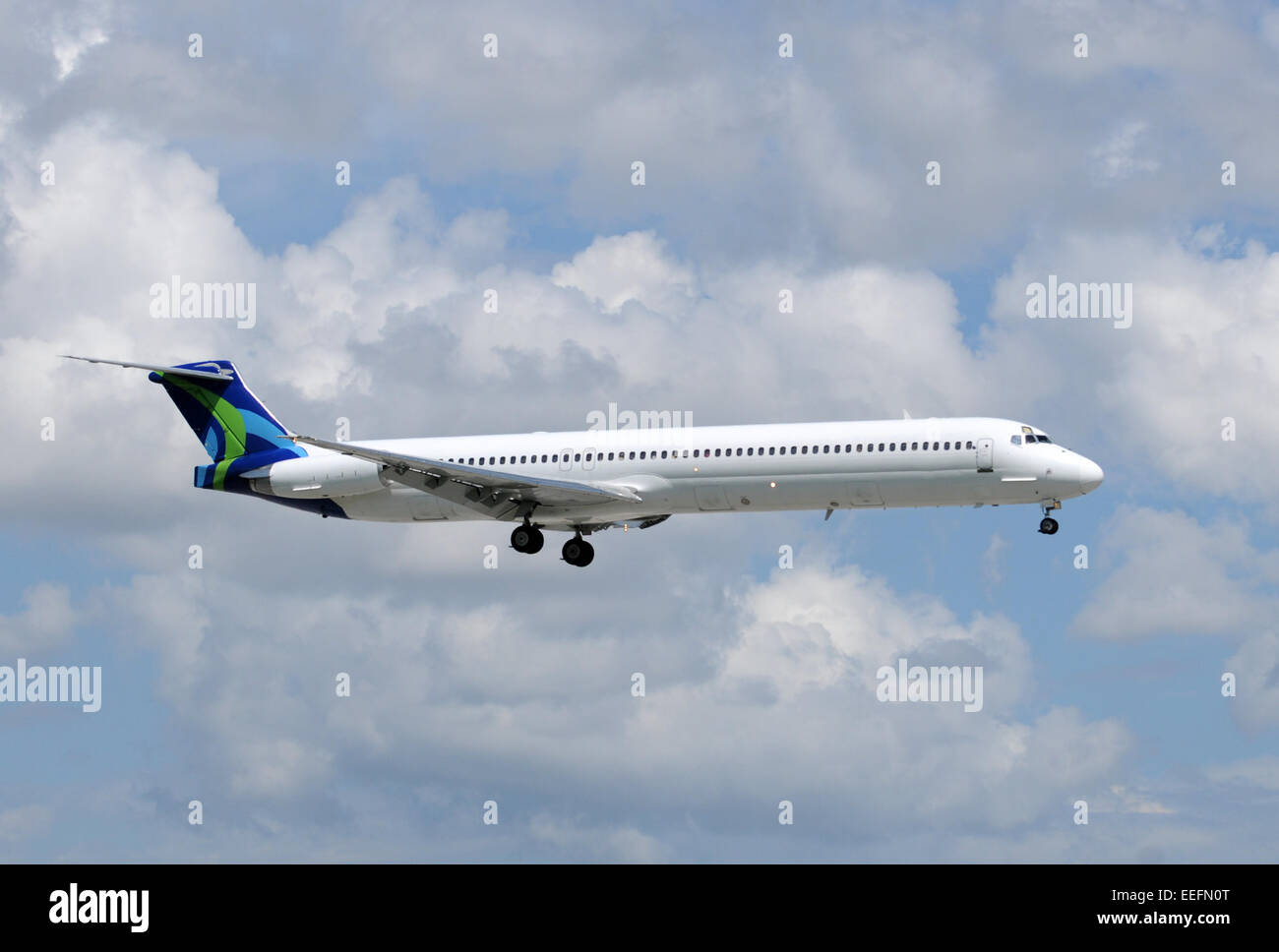 Passenger jet airplane in flight side view Stock Photo
