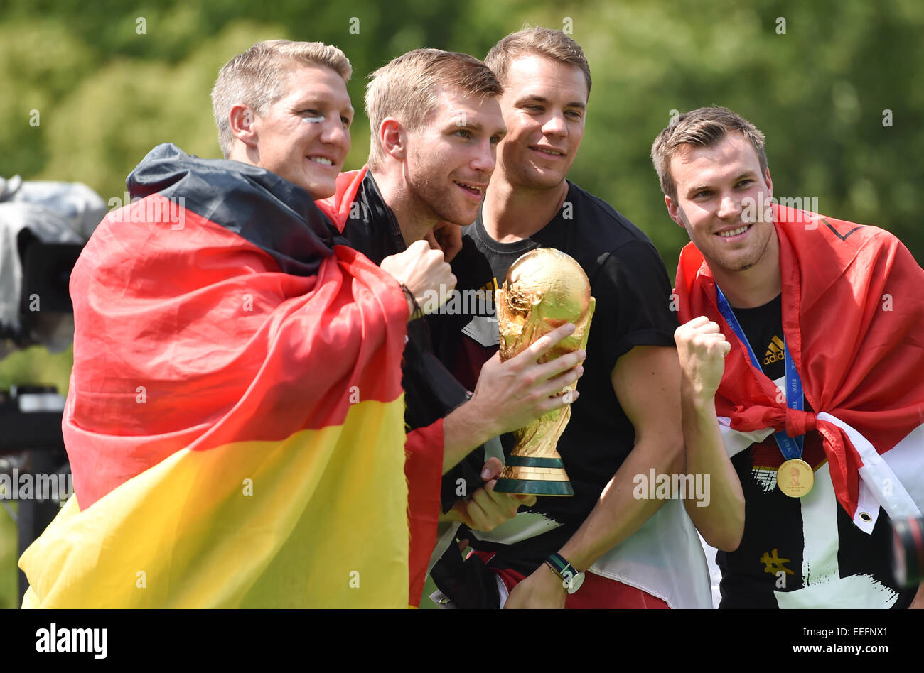 The Germany national football team celebrating their victory at Brandenburg Gate (Brandenburger Tor). 400,000 fans gathered at the so called Fanmeile to greet the winners of the 2014 World Cup.  Featuring: Bastian Schweinsteiger,Manuel Neuer,Kevin Großkre Stock Photo