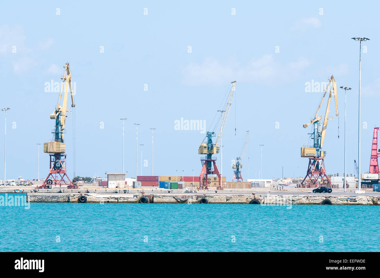 Loading cranes in the Heraklion harbor, Crete, Greece Stock Photo