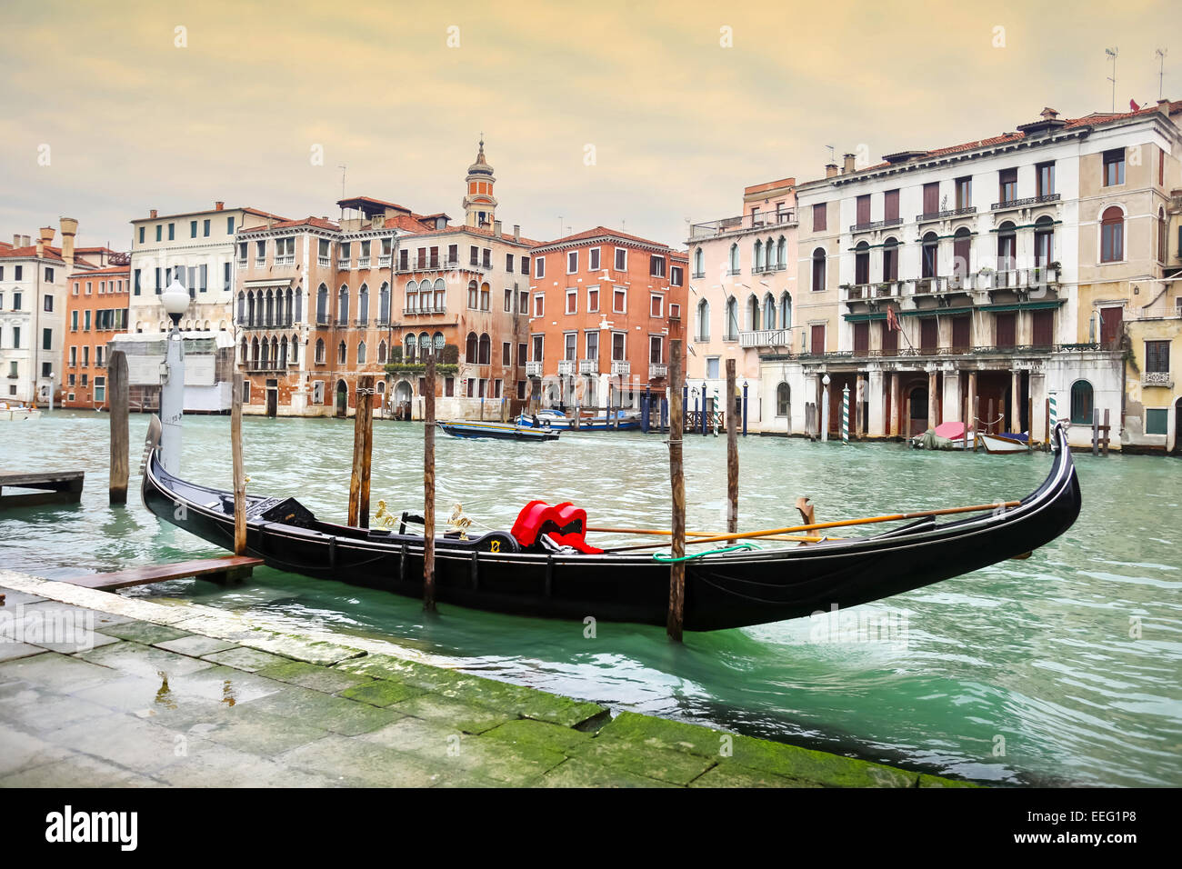 A view of an empty gondola parked in a Campo Erberia square on grand canal in Venice, Italy. Stock Photo