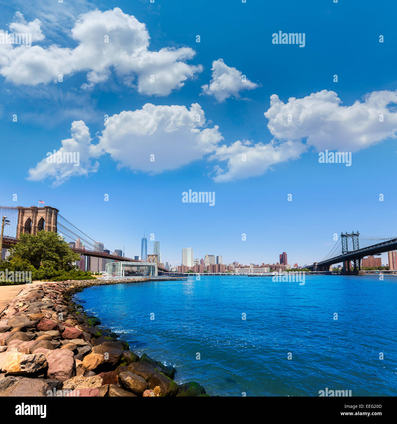 Brooklyn and Manhattan Bridges with New York city sunshine skyline US ...