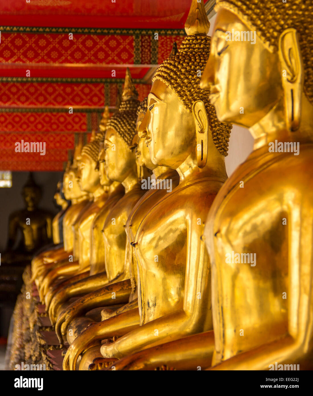 Row of Golden Buddhas at Wat Pho, Bangkok. Stock Photo