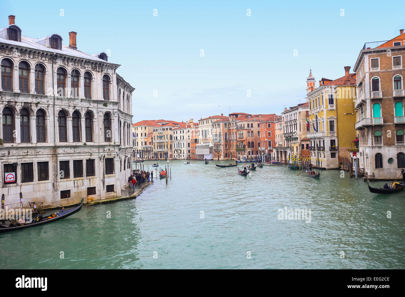 Gondolas with tourists sailing through a grand canal next to a Campo Erberia square on February 15th, 2014 in Venice, Italy. Stock Photo