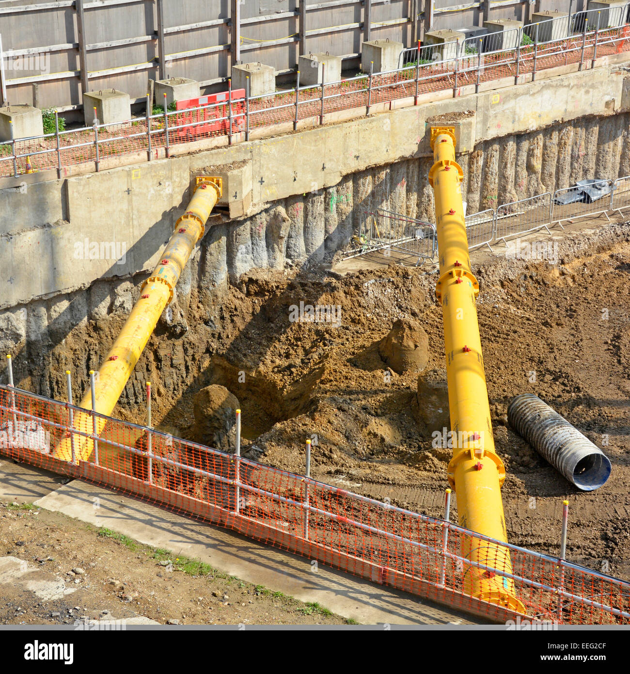 Hydraulic corner bracing struts placed on retaining walls during basement foundation work on old