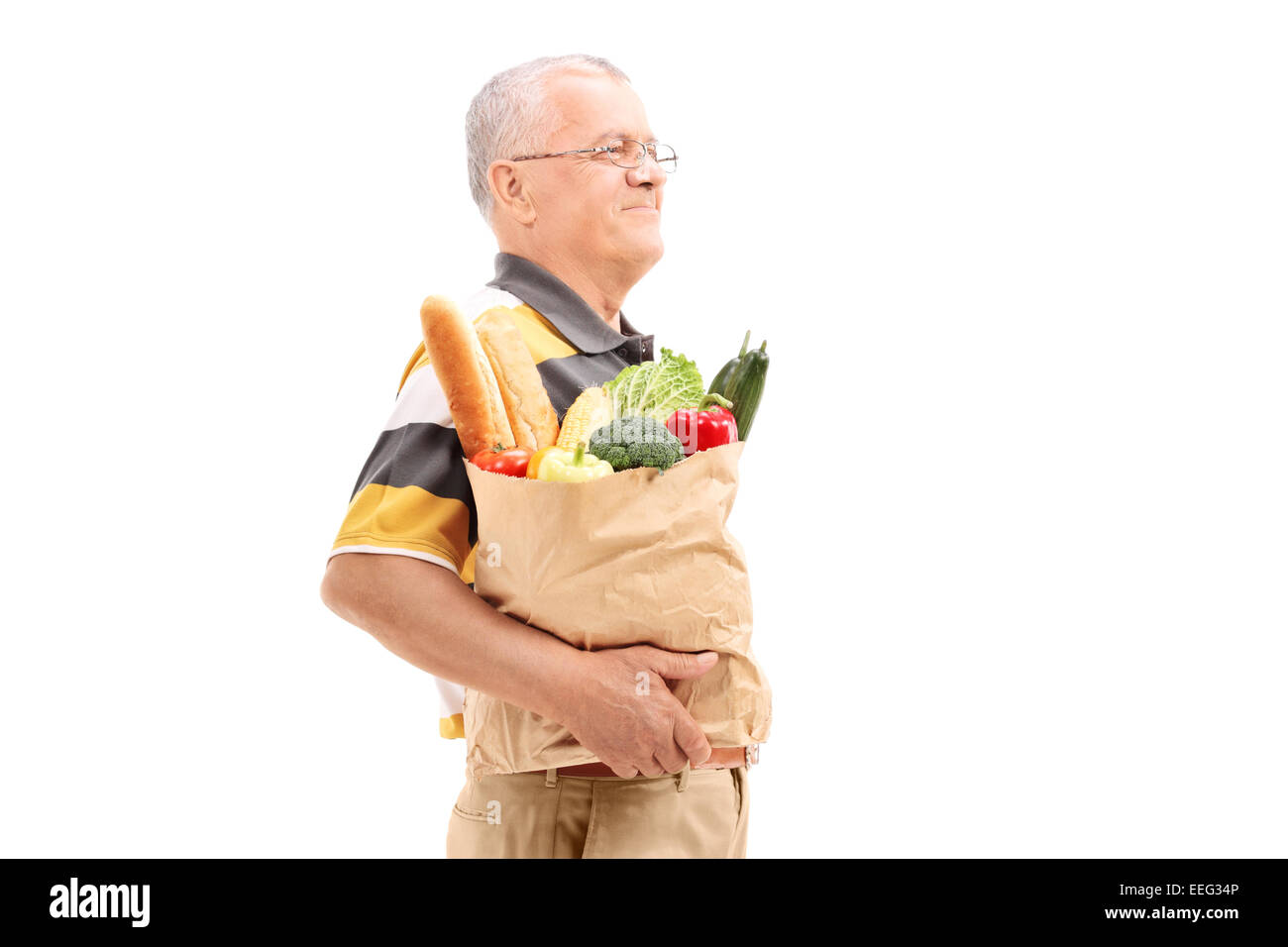 Senior man walking shopping bag hi-res stock photography and images - Alamy