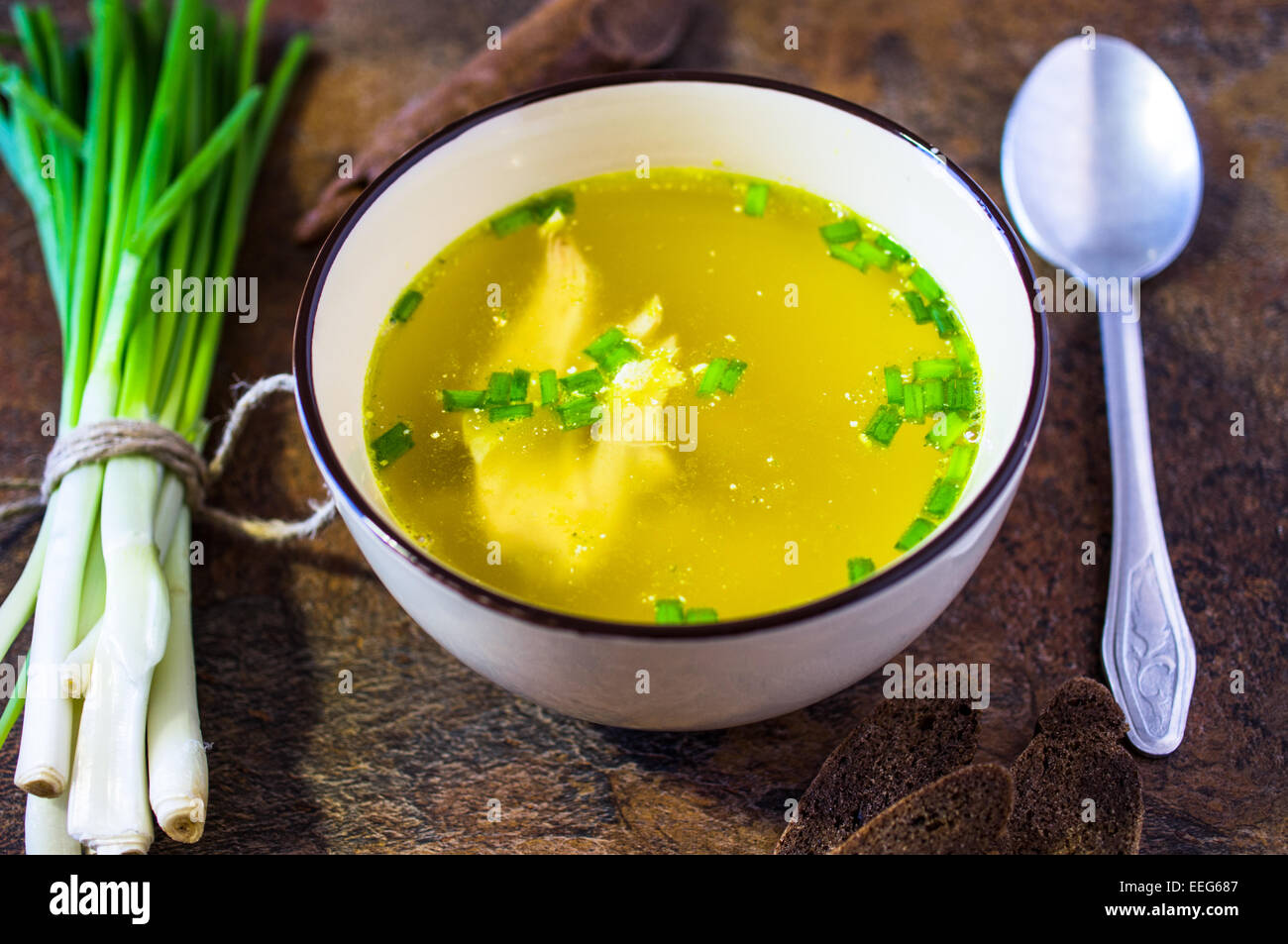 Chicken broth soup with herbs Stock Photo Alamy