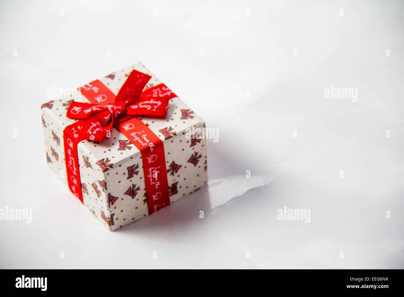 Gold gift box with ribbon and bow isolated on white background Stock ...