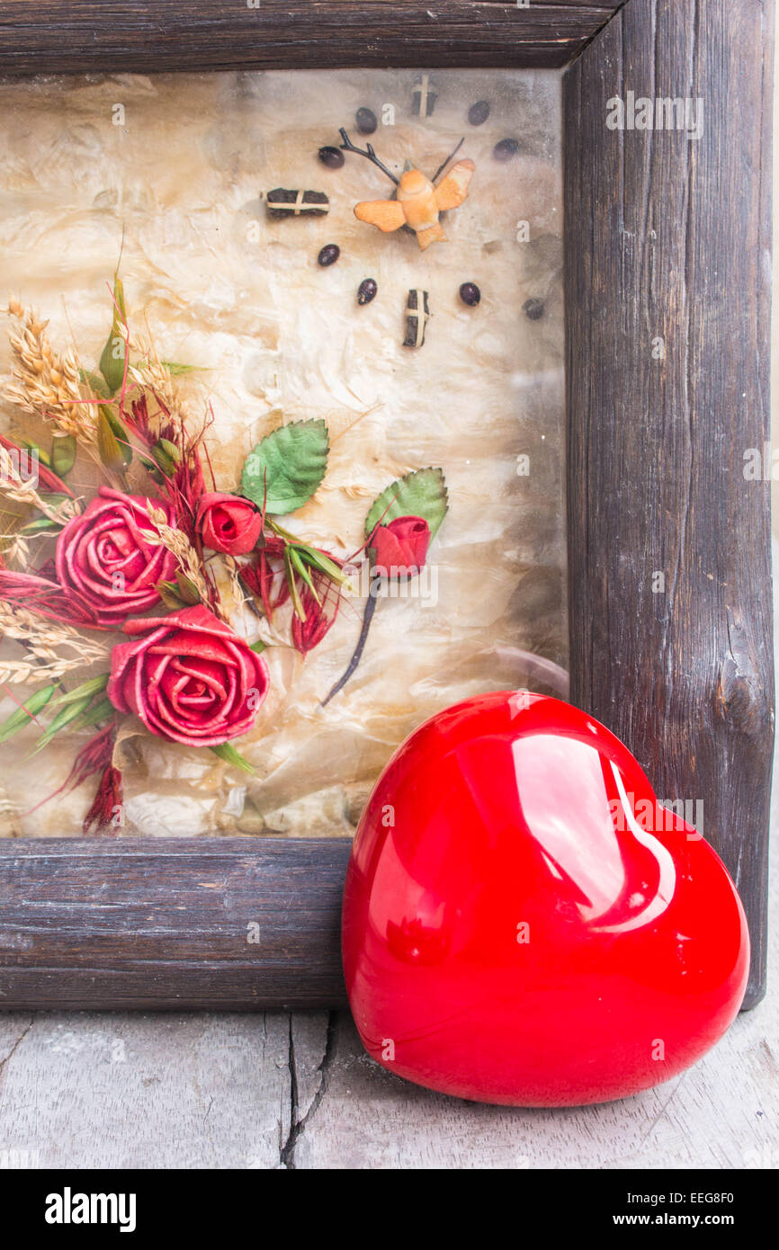 Heart and frame on a wooden Stock Photo - Alamy