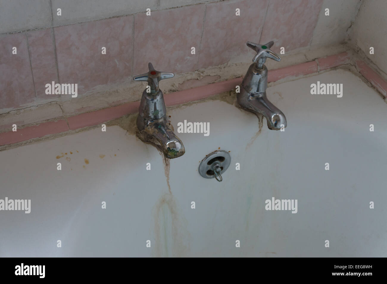 English bathtub and taps that have suffered from neglect Stock Photo