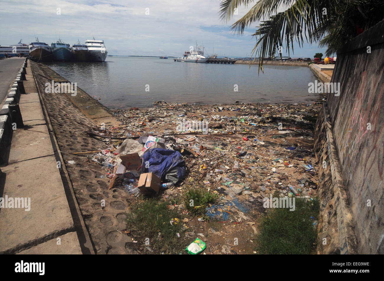 Port waters choked with trash and refuse, mainly plastic. Town of Sorong, Papua province, Indonesia. No PR Stock Photo