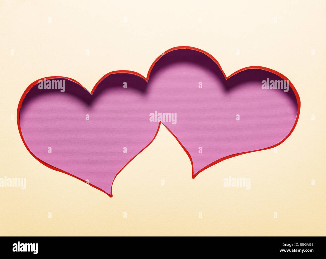 Two hearts cutout in paper. Card design. Stock Photo