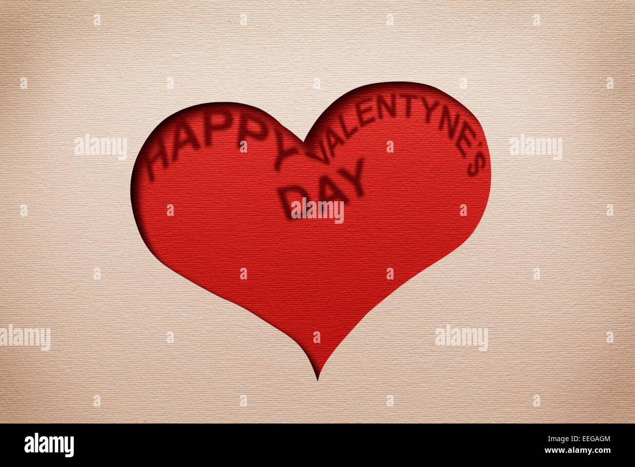 Two hearts cutout in paper with words 'Happy Valentine's Day' inside. Stock Photo