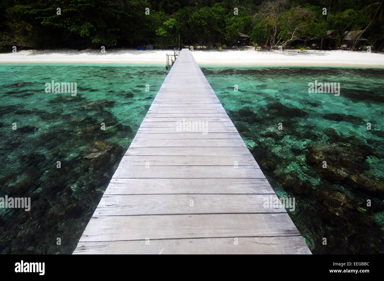 Jetty crossing reef to resort, Gam Island, Raja Ampat, Papua province, Indonesia. No PR Stock Photo