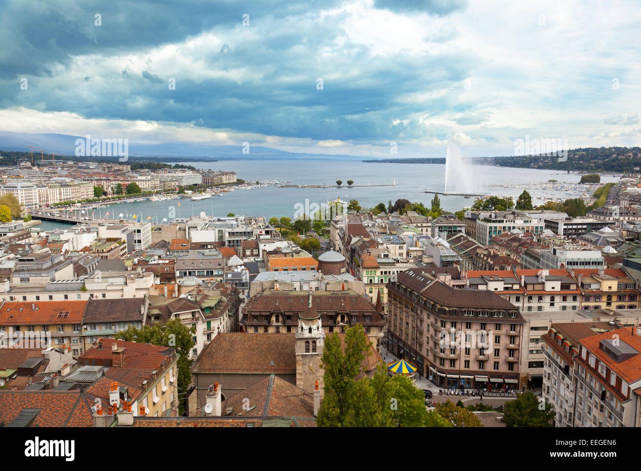 A fountain Jet dEau rises over the waterfront of Lake Geneva, Geneva, Switzerland Stock Photo