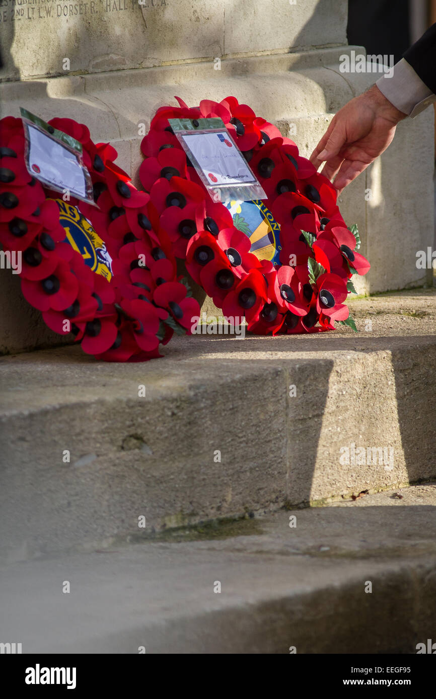 Laying a poppy wreath on Remembrance day Stock Photo