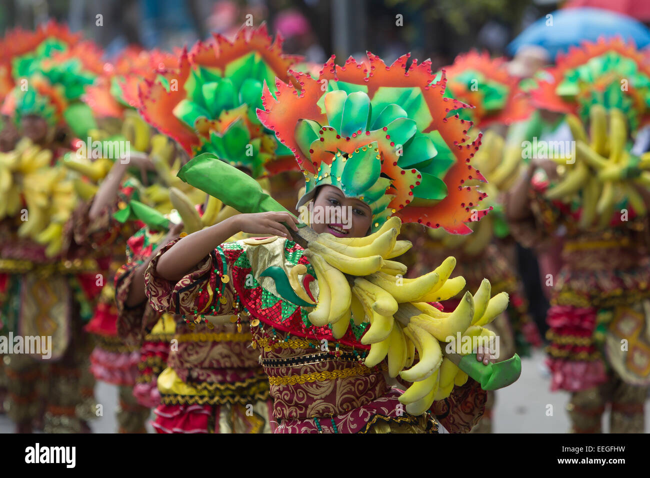 Cebu City, Philippines. 18th Jan, 2015. One of the largest festivals in the Philippines takes place over a nine day period in January. Celebrating the Catholic belief in the Jesus child Santo Nino, various religious ceremonies are held culminating in the Sinulog Grande Parade,a procession of street dancing throughout the City. Credit:  imagegallery2/Alamy Live News Stock Photo