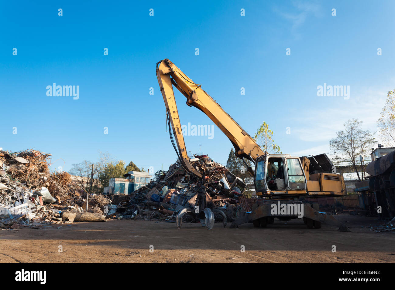 side view of crane on recycling junkyard Stock Photo