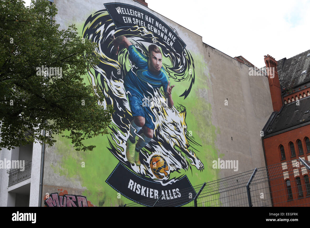 German football player Mario Götze, who scored the only goal in the World Cup Final against Argentina, is immortalized in a street art painting in Charlottenburg.  Featuring: Mario Götze Where: Berlin, Germany When: 16 Jul 2014 Stock Photo