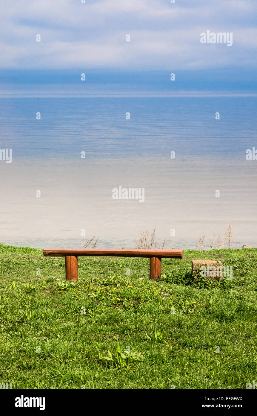 Landscape with the Bench for Meditation on Seacoast Stock Photo