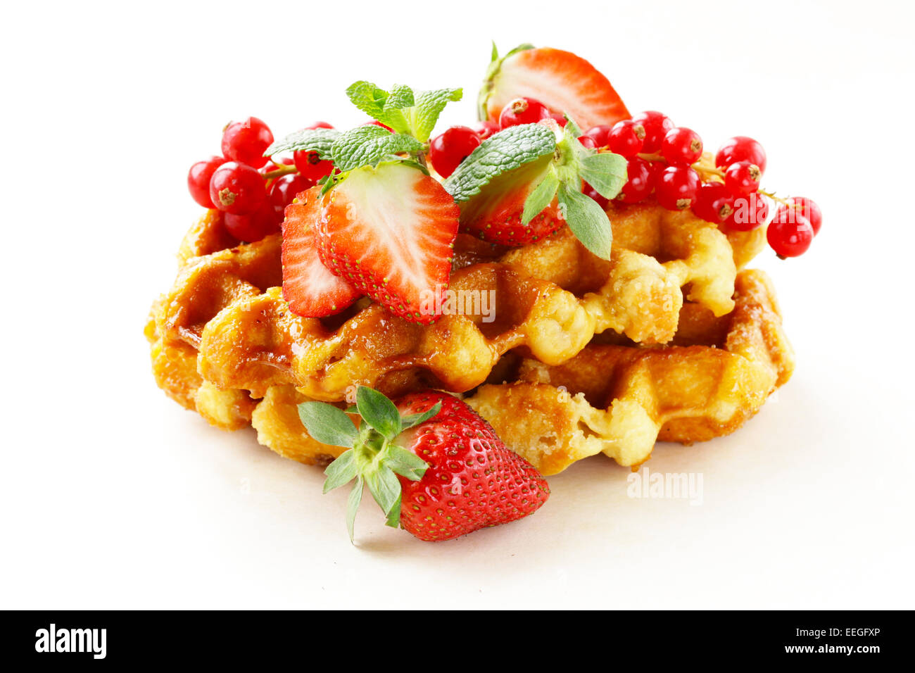 homemade Belgian waffles with berries (currants and strawberries) Stock Photo