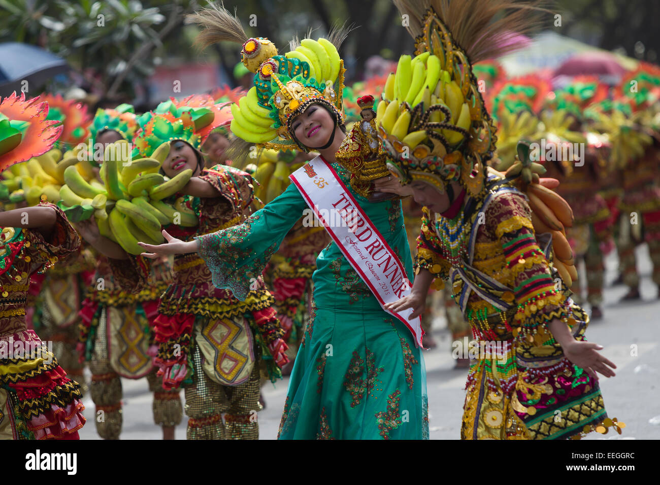 Cebu City, Philippines. 18th Jan, 2015. One of the largest festivals in the Philippines takes place over a nine day period in January. Celebrating the Catholic belief in the Jesus child Santo Nino, various religious ceremonies are held culminating in the Sinulog Grande Parade,a procession of street dancing throughout the City. Credit:  imagegallery2/Alamy Live News Stock Photo