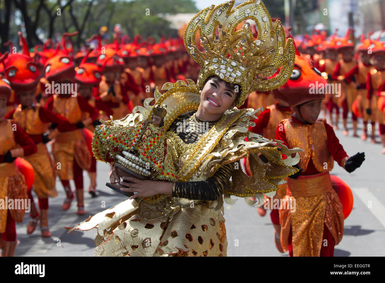 Cebu City, Philippines. 18th Jan, 2015. One of the largest festivals in the Philippines takes place over a nine day period in January. Celebrating the Catholic belief in the Jesus child Santo Nino, various religious ceremonies are held culminating in the Sinulog Grande Parade,a procession of street dancing throughout the City. Credit:  imagegallery2/Alamy Live News Stock Photo