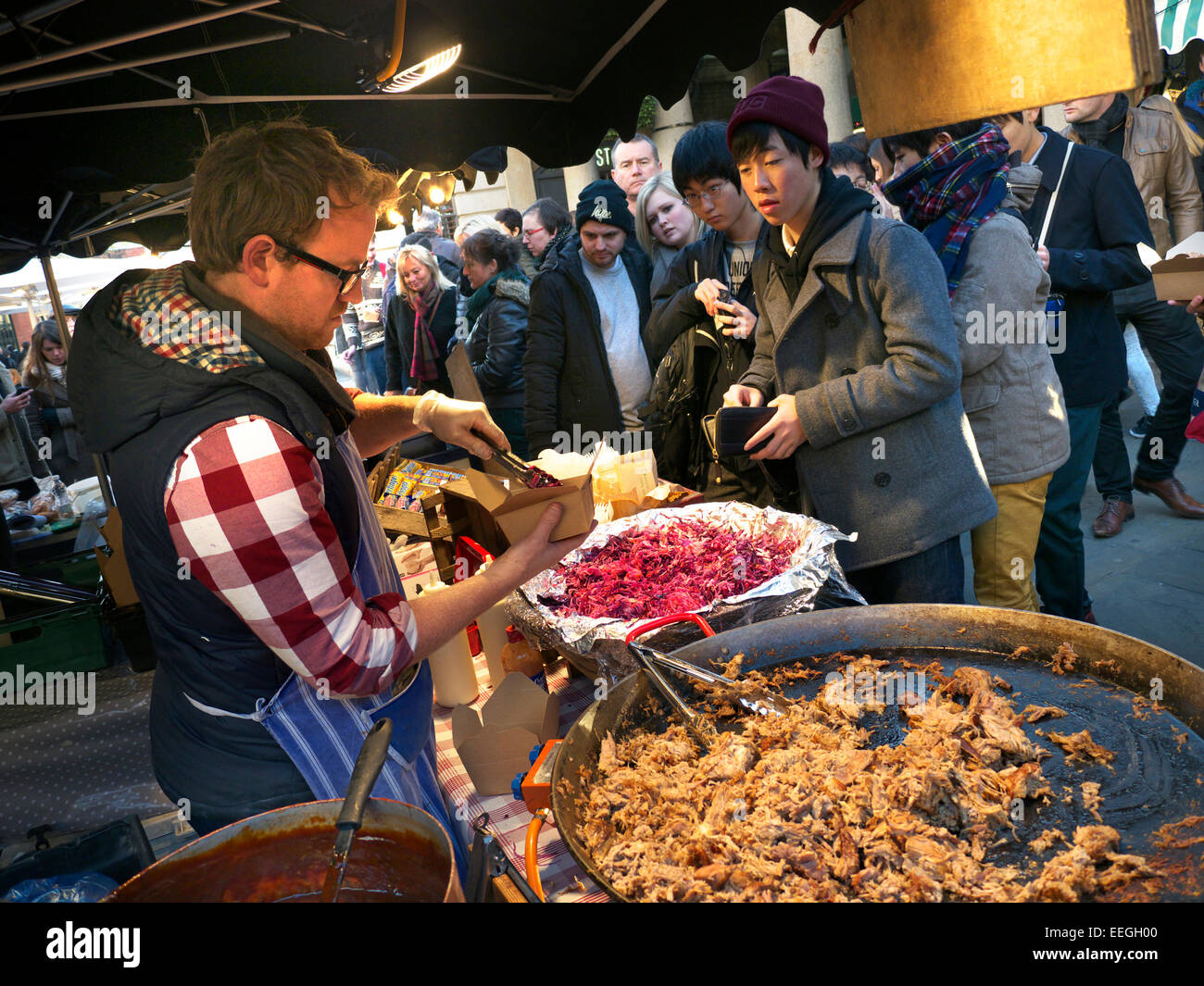 Alfresco dining Hot fast food on sale at Covent Garden street food piazza  market stall London UK Stock Photo - Alamy