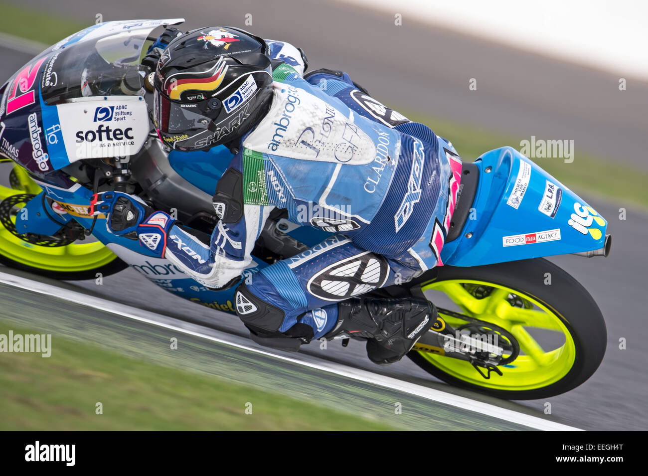 Motorcycle rider with his knee down in a corner hi-res stock ...